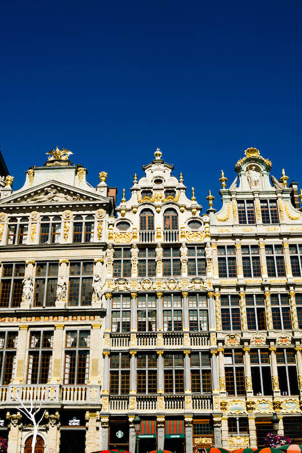 Beautiful buildings in Grote Markt (Grand Place) in Brussels.  Read why you should visit this beautiful UNESCO recognized square in Brussels! #travel #brussels #belgium #europe