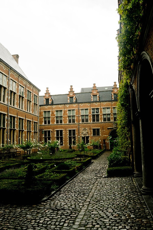 Courtyard of plantin-moretus museum, one of the best museums in Antwerp, Belgium.  This UNESCO recognized attraction in Belgium. #travel #antwerp #belgium