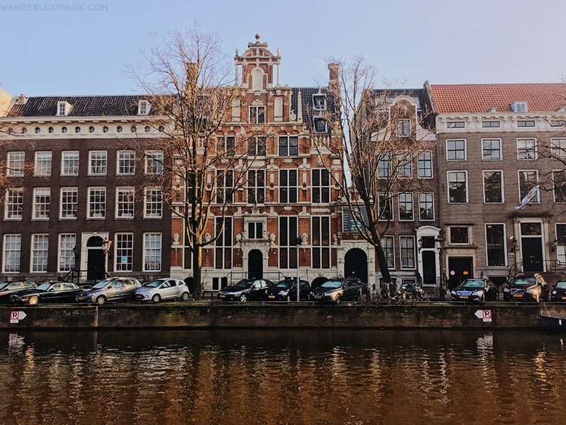 Photo of beautiful architecture in Amsterdam. Find out what you can do in Amsterdam in a day with a free self guided walking tour of Amsterdam by a local.