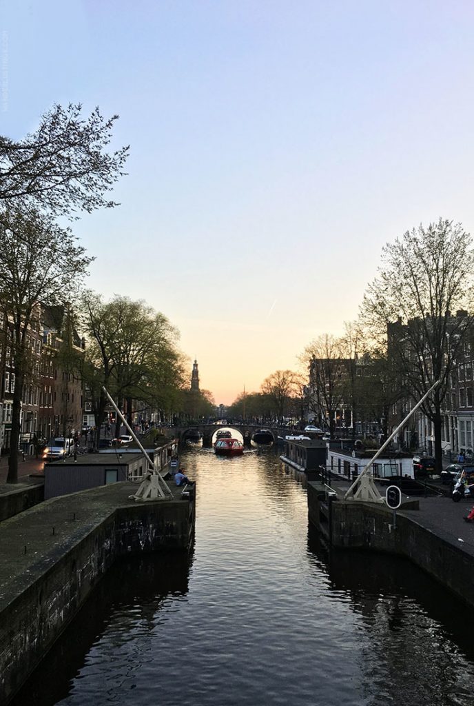 Canal in Amsterdam. Read the perfect 1 day itinerary for Amsterdam with insider tips by a resident, a self guided, full walking tour, and a map!