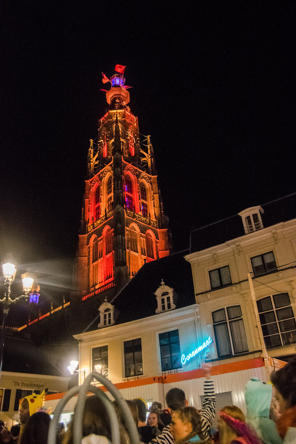 Breda's tower lit up for Carnival. Read about celebrating carnaval in Kielegat! #travel #breda #netherlands