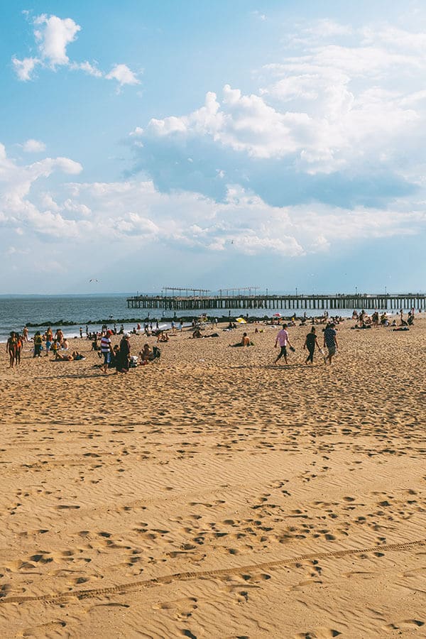 New Yorkers enjoying the beach on Coney Island, Brooklyn, New York