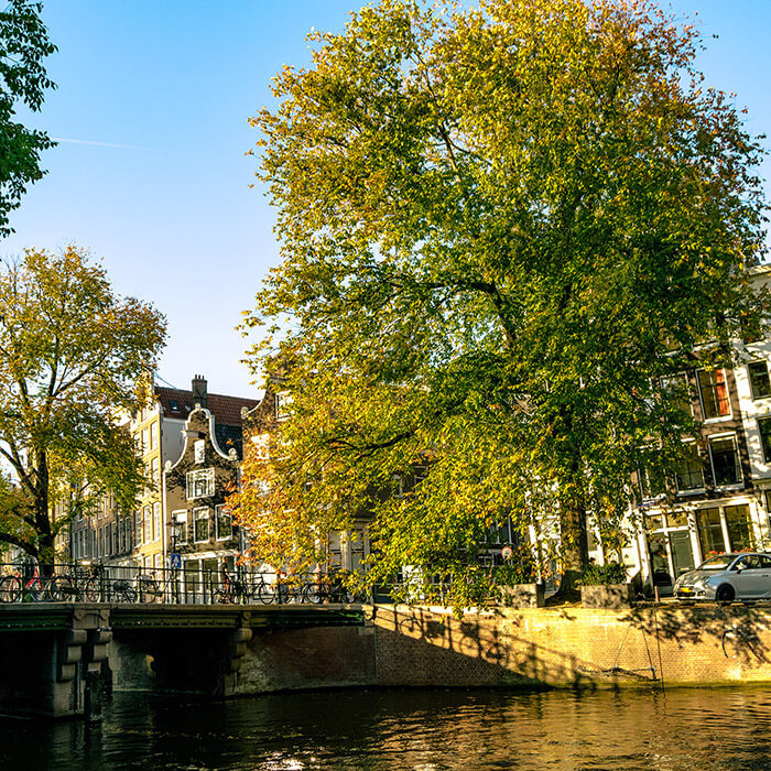 Beautiful scene in Amsterdam in fall.  If you're visiting the Netherlands, you need to see the Netherlands beyond Amsterdam.  Click for the perfect itinerary!  #amsterdam #holland #netherlands #travel