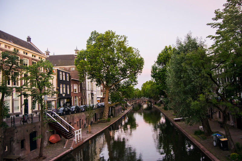 Sunset on canals in Utrecht. Visit the most beautiful day trip from Amsterdam, Utrecht. Consider spending one day in utrecht using this guide of things to do in utrecht! #travel #utrecht #netherlands #europe #canals