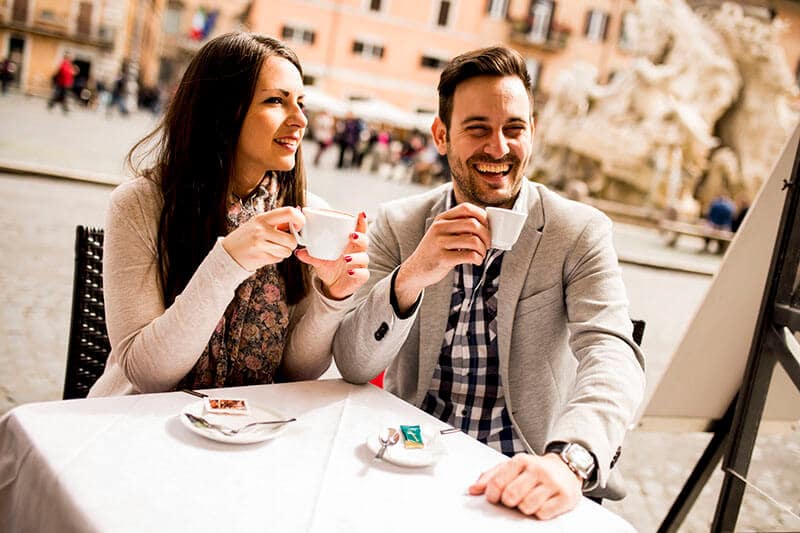 Couple enjoying an espresso in Rome Italy during their honeymoon