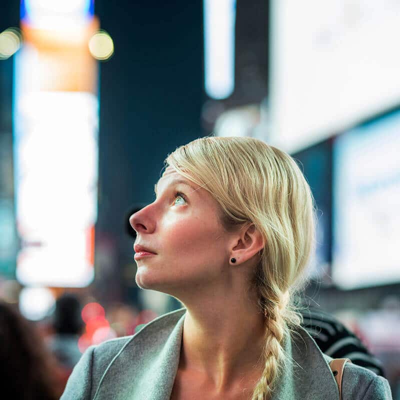 Girl enjoying Times Square at night