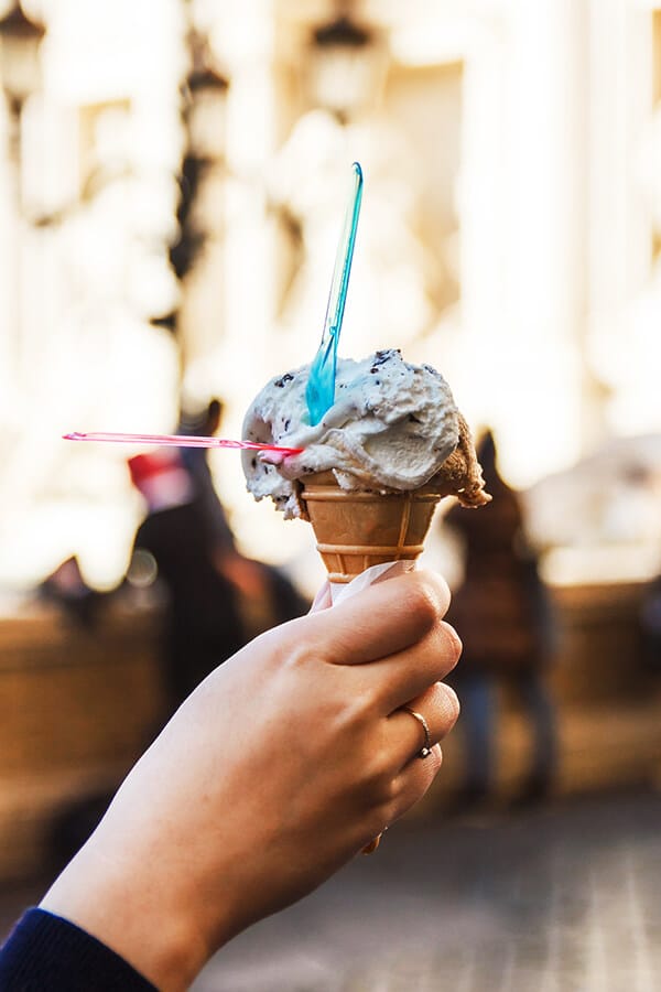 Scoop of gelato in front of the Trevi Fountain in Rome, Italy