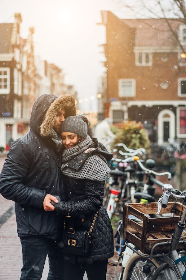 Couple enjoying shopping in the Nine Streets, one of the most romantic things to do in Amsterdam.   Read your perfect couple's guide to Amsterdam.  