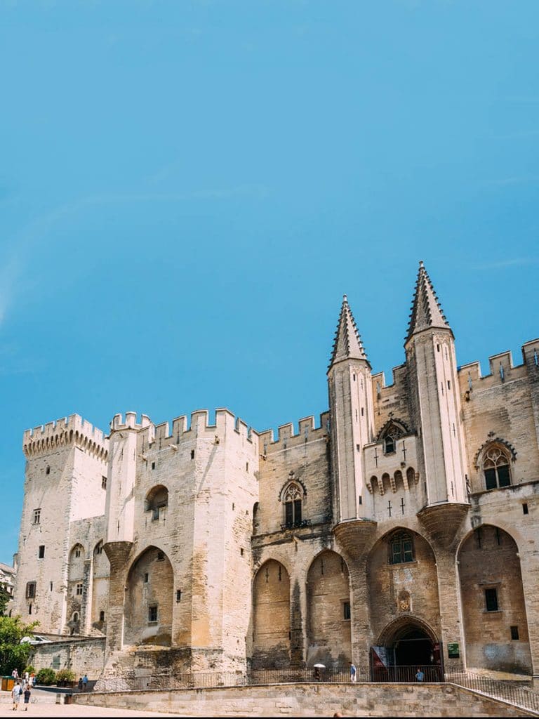 Palace of the Popes in Avignon, France with beautiful blue sky 