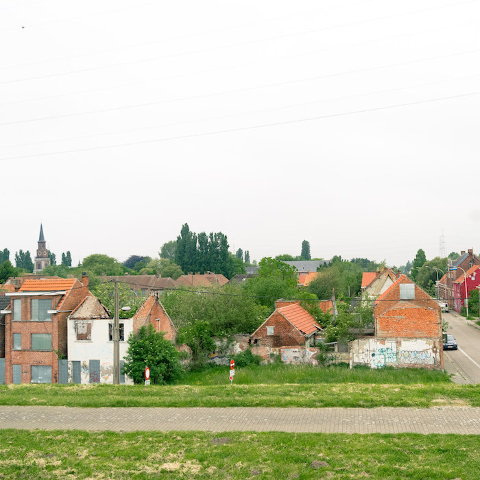 Photo of the Belgian ghost town of Doel, Belgium. Read what it's like to visit this semi-abandoned town in Belgium full of street art. #travel #belgium #abandonedplaces #doel