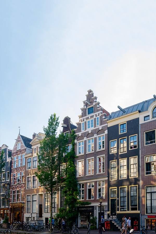 Beautiful daytime photo of the Red Light District in Amsterdam with coffeeshops and cafes.