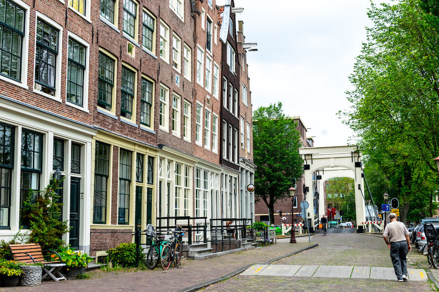 Beautiful row of captain's houses along Realeilande in the Western Islands in Amsterdam.  This beautiful neighborhood is worth visiting!  #amsterdam #travel #netherlands