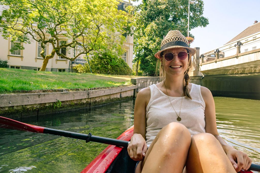 Smiling local in the Netherlands enjoying a kayaking trip during meet-up