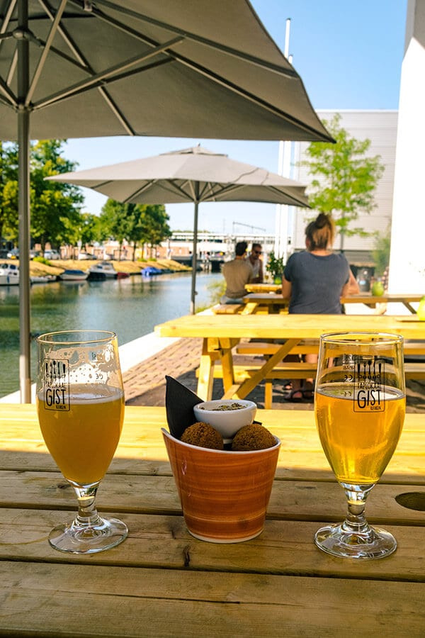 New friends who met using an app sharing a beer in the Netherlands.  We met using an app to meet new friends while traveling! 