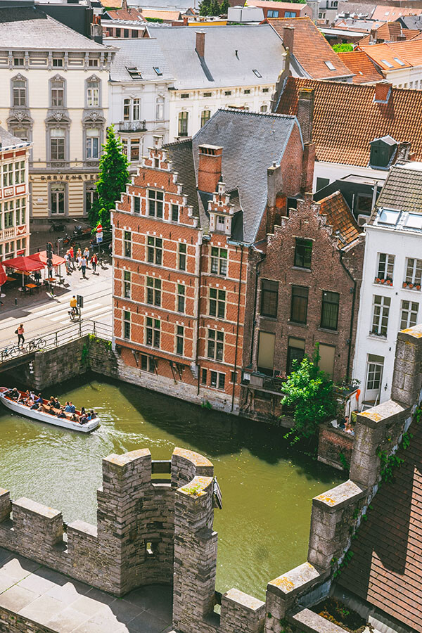 Leie River in Gent with canal cruise seen from Gravensteen castle, one of the best things to do in Ghent.
