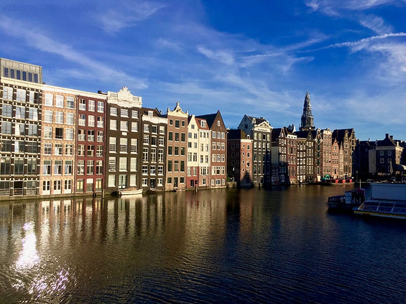 Photo of canal houses in Amsterdam. Read the perfect Amsterdam itinerary for 24 hours in Amsterdam. Includes the best things to do in one day in Amsterdam 