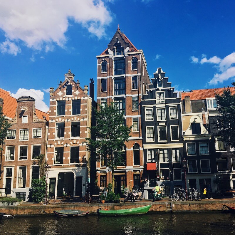 Beautiful canal houses in Amsterdam.  Read how to find the perfect apartment in Amsterdam for expats in this guide to renting in Amsterdam!