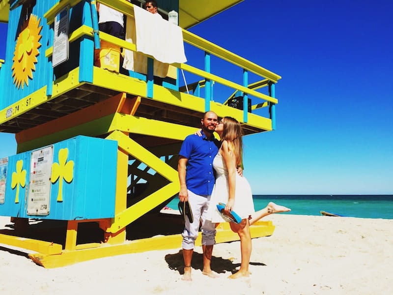 Photo of couple kissing on beach from their elopement in Miami. Read reasons to elope and find elopement inspiration!