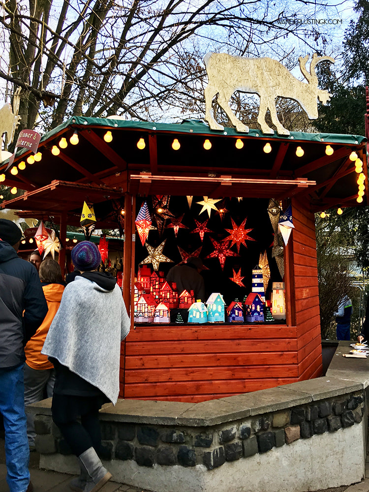 Decorated Christmas Market Stall in Cologne Germany. Get a free map of the Cologne Christmas Markets with a walking tour! #Cologne #Christmas #Germany