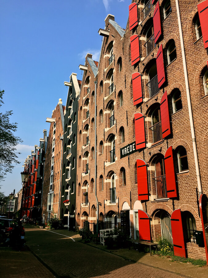 Beautiful old warehouses along Prinseneiland, one of the prettiest streets in Amsterdam not to miss! #travel #netherlands #amsterdam #holland