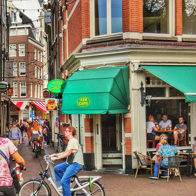 Tourists enjoying cannabis at one of the best coffeeshops in Amsterdam 