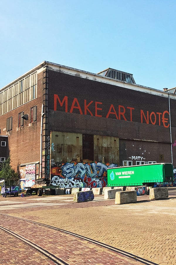 Make Art Not€, one of the cool graffiti exhibits in the NDSM neighborhood of Amsterdam Noord! #travel #graffiti #art #amsterdam