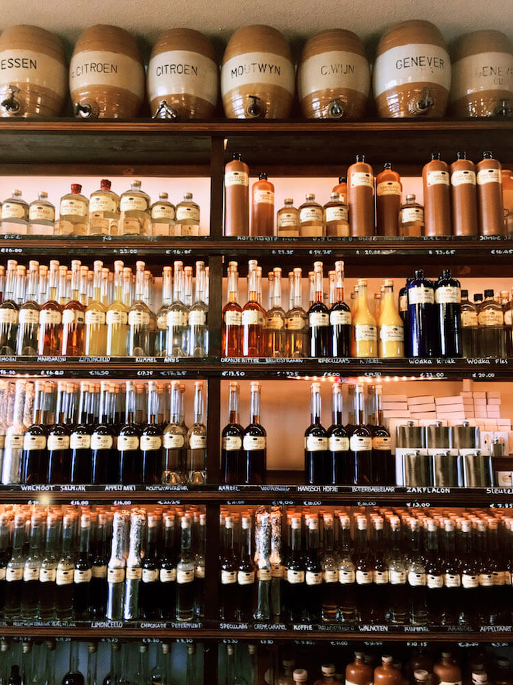 Photo of bottles of jenever/genever at Van Kleef Distillery, one of the best places to visit in the Hague during one day in the Hague. Get insider tips for what to do during one day in the Hague! #travel #Netherlands #jenever #genever #Nederland #alcohol #DenHaag #TheHague #Holland
