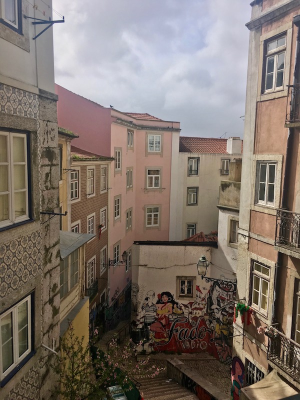Windy street in Lisbon, Portugal. Lisbon is worth including on your Eurotrip plan! #travel #portugal #lisbon