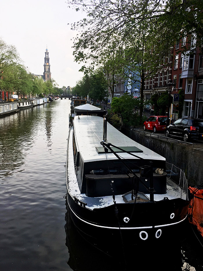 Canal in Amsterdam. Read about the best things to do in Amsterdam during your long weekend in Amsterdam with the perfect three day itinerary for Amsterdam! #Amsterdam #Netherlands #travel