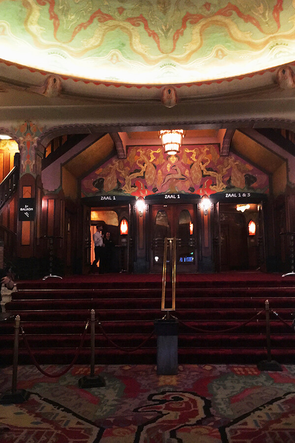 Beautiful art deco theatre in Amsterdam.  Pathe Tuschinski is one of the best places to go on a date in Amsterdam. #travel #amsterdam 