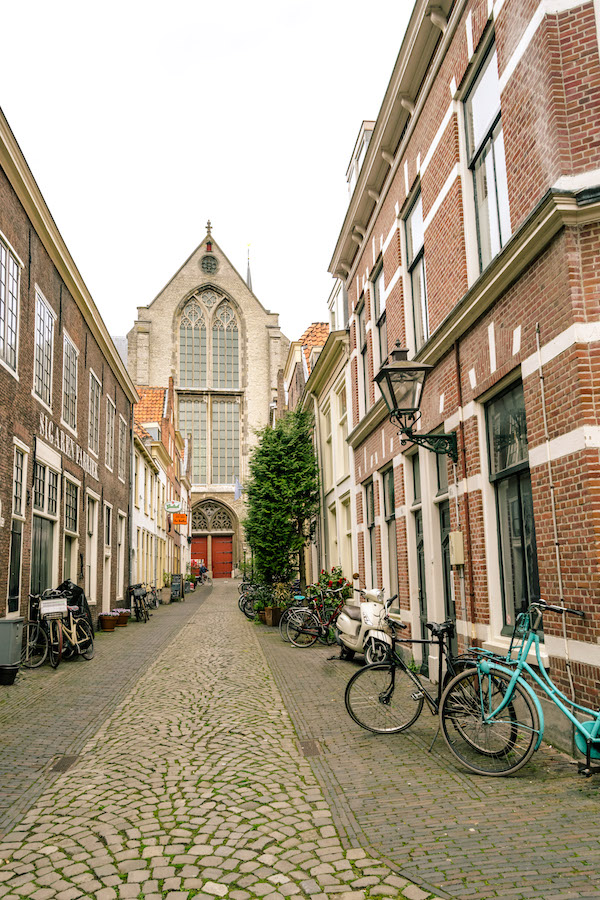 Pieterskerk in distance in the Pieterskwartier in Leiden. Read about the best things to do in Leiden, the Netherlands! #travel #Netherlands #holland #leiden