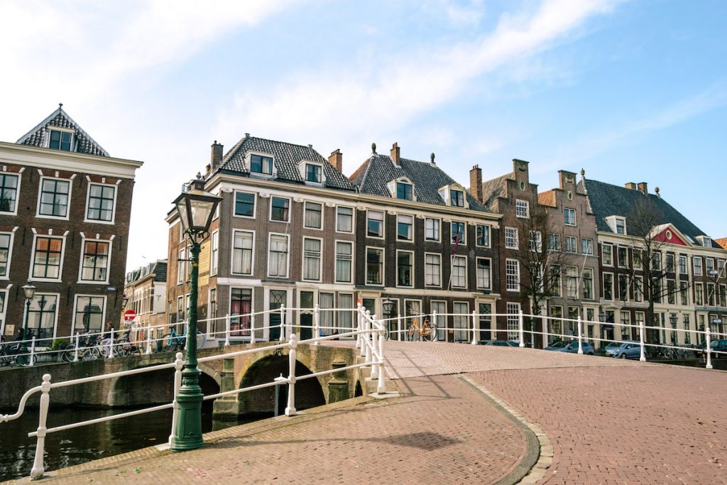 Beautiful Rapenburg canal in Leiden. Read about what to do in one day in Leiden, one of Amsterdam's best day trips. #travel #leiden #holland #canals #netherlands