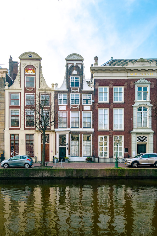 Houses on Rapenburg, the prettiest canal in Leiden. Read what to do in Leiden in this complete guide to Leiden, one of the cutest day trips from Amsterdam! #travel #netherlands #holland #Leiden #canals