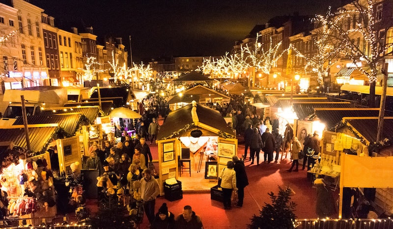 The lit up floating Christmas market in Leiden during December is one of the best seasonal activities in Leiden.