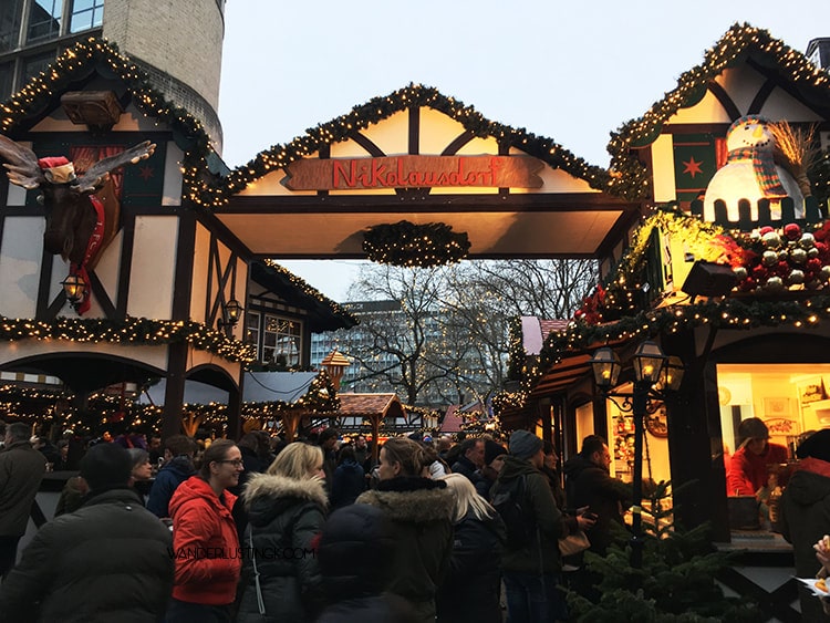 Read about the best Christmas markets in Koln Germany. Photo of Rudolfplatz Christmas Market.