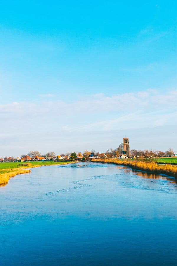 View of Ransdorp, one of the prettiest day trips from Amsterdam.  You can bike here on a picturesque afternoon from Amsterdam in just thirty minutes! #amsterdam #holland #travel