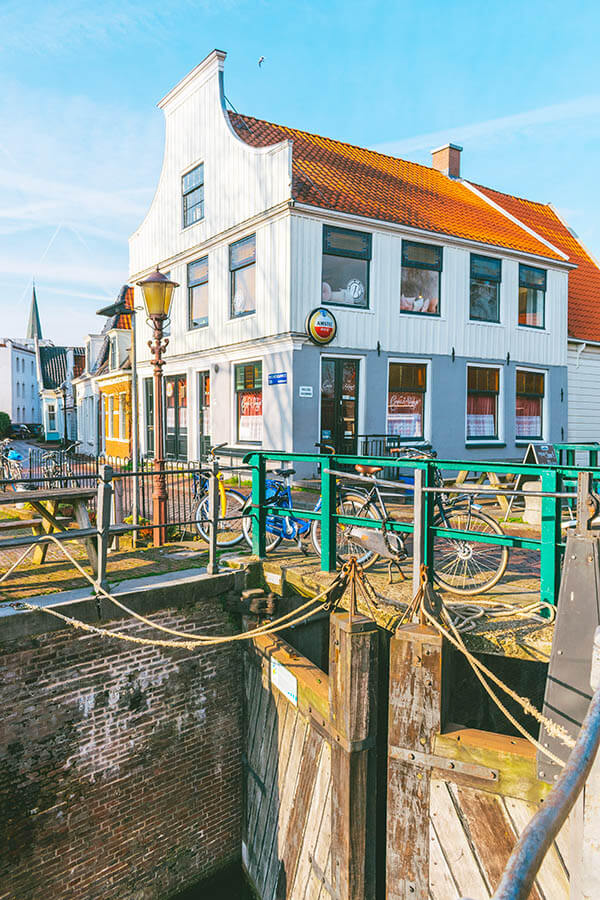 Exterior of a historic brown bar in Amsterdam Noord, one of the best cozy brown bars in Amsterdam! 