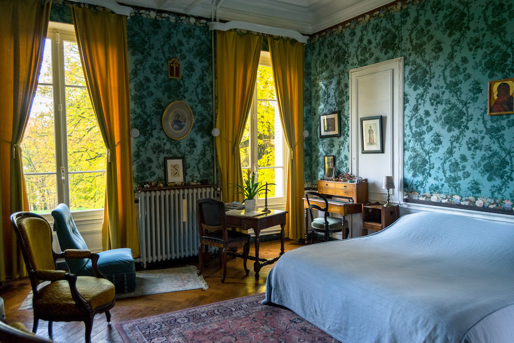 Room at chateau in France with antique furniture. Read what it's like to stay at a castle in France with bucket list inspiration for staying in a chateau! #travel #france