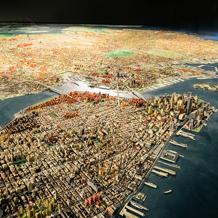 Curious about seeing New York City from above without a helicopter? Head to the Queens Museum of Art to see this miniature version of New York City that was made to scale.  This budget friendly activity in New York is perfect for families. #travel #NYC #NewYork 