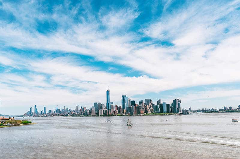 View of old Clipper with view of Manhattan on a sunny day from the crown of the Statue of Liberty