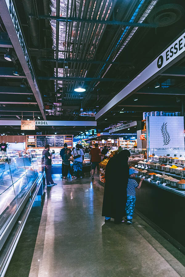 Interior of the new Essex Street Market with woman browsing