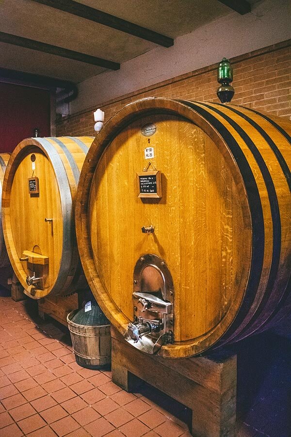 Wine barrel seen during a vineyard tour and tasting of a Piedmont winery producing Barbaresco