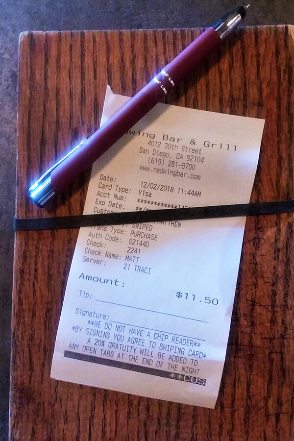 Typical American receipt showing a blank line to specify the tip amount in the US.  On average, you should be tipping around 18% at restaurants in the United States! #travel #america #unitedstates