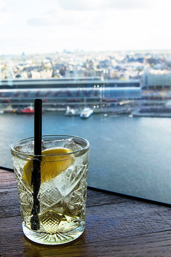 Cocktail with a view at A'DAM tower, one of the best places to watch the sunset in Amsterdam.  This stunning viewpoint in Amsterdam Noord has a view of Amsterdam Centre. #amsterdam #netherlands #travel #cocktails