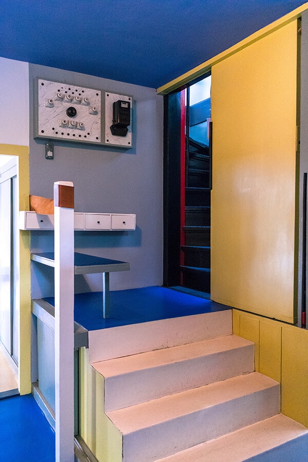 The entrance to the staircase of the Rietveld schröderhuis.  The interior of this house is an icon of De Stijl due to its use of primary colors! #design #interiordesign #architecture #destijl