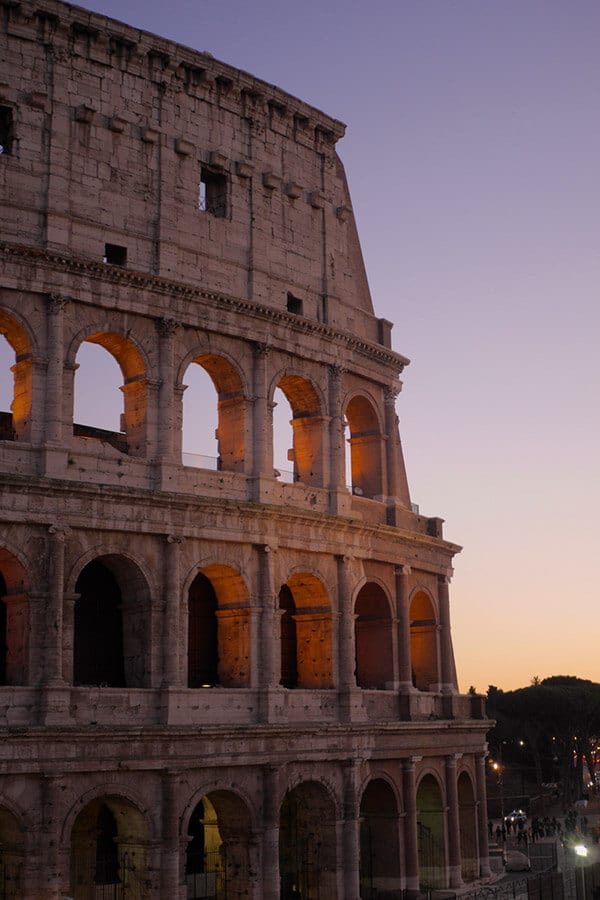 Beautiful view of the Coliseum in Rome at sunset.  This self-guided walking tour of Rome shows you the best that Rome has to offer by taking you away from the crowds! #rome #italy #travel #roma #italia 