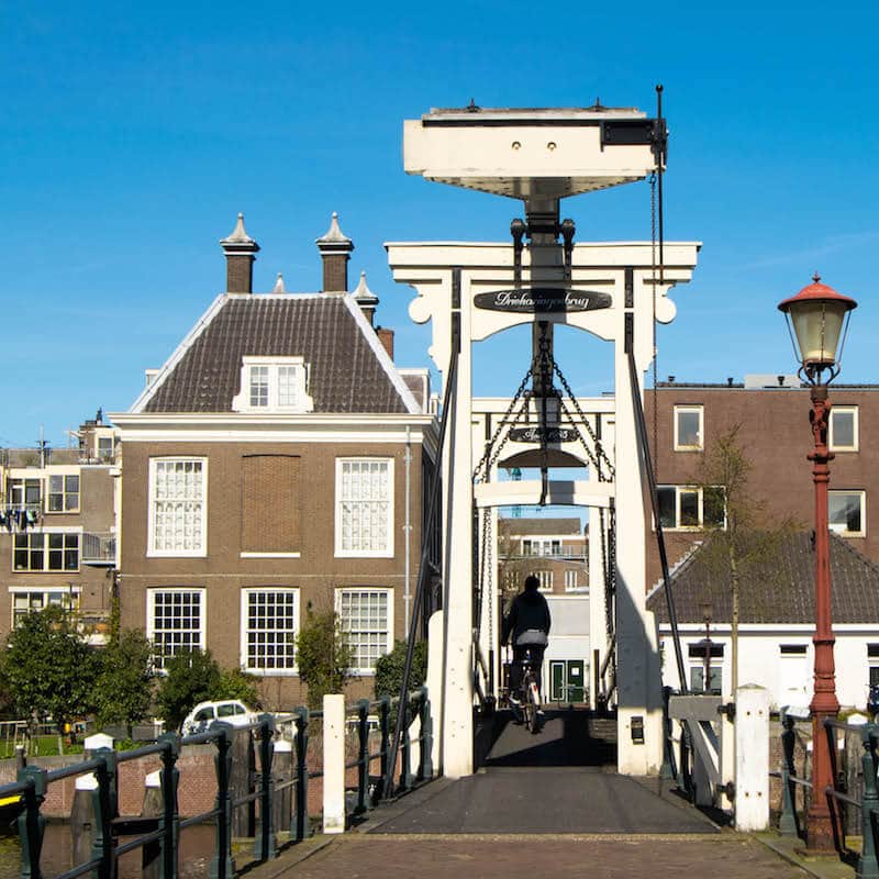 Drieharingenbrug, one of the highlights of the westelijke eilanden in Amsterdam.  This quiet neighborhood is full of gorgeous streets and bridges! #travel #netherlands #holland #amsterdam